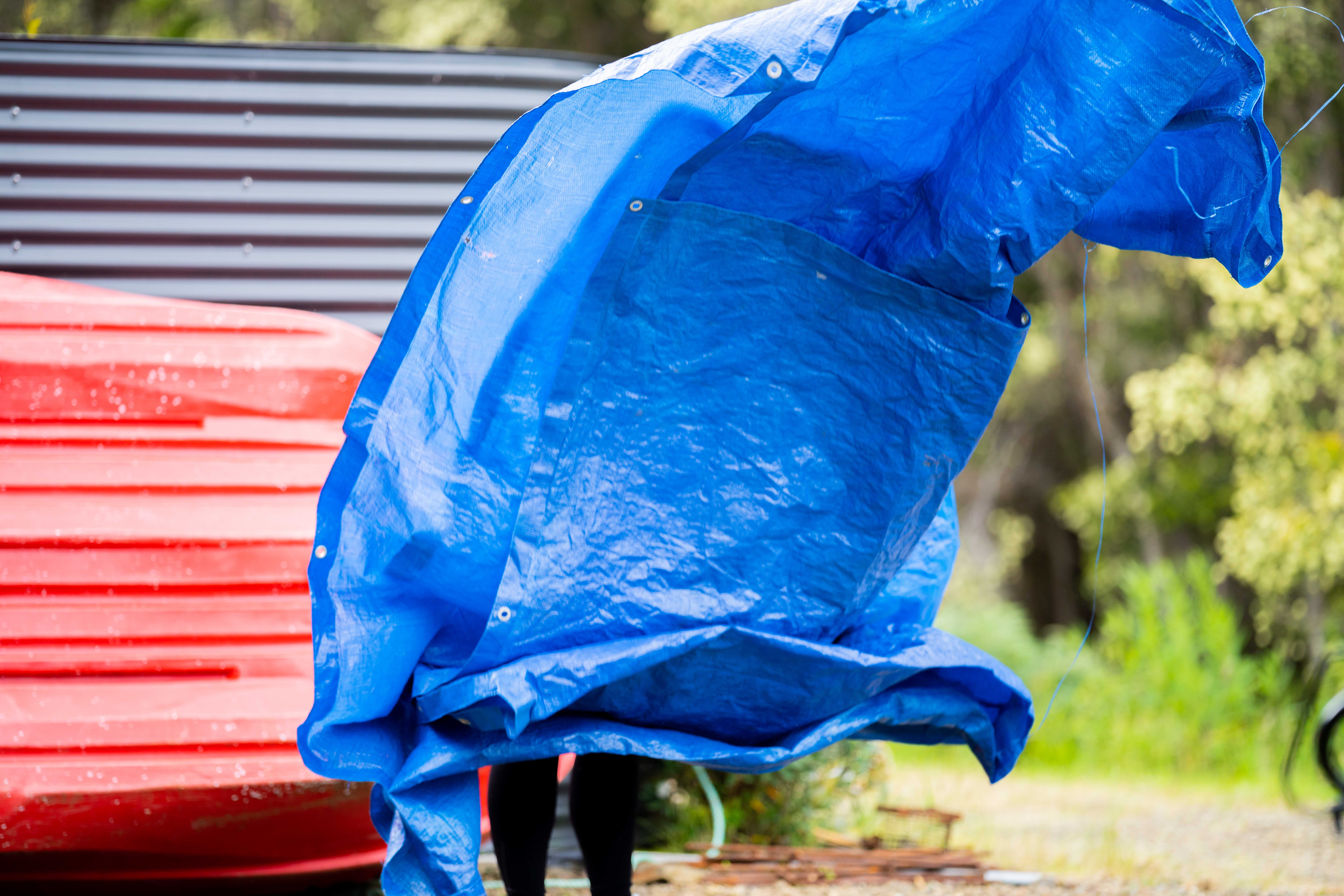 Tidying a tarp.